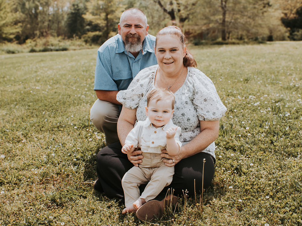 NHI Studio City Graduate Tawnya Coia (center) with her husband, Jason and son, Archer