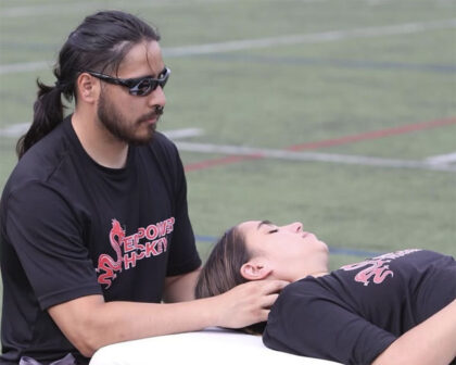 Paul Gowans working with an athlete on the sidelines
